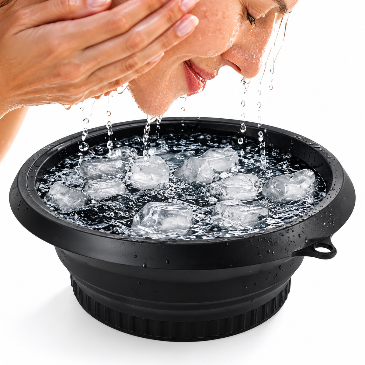 Woman splashing her face over a black face ice bath bowl filled with water and ice cubes
